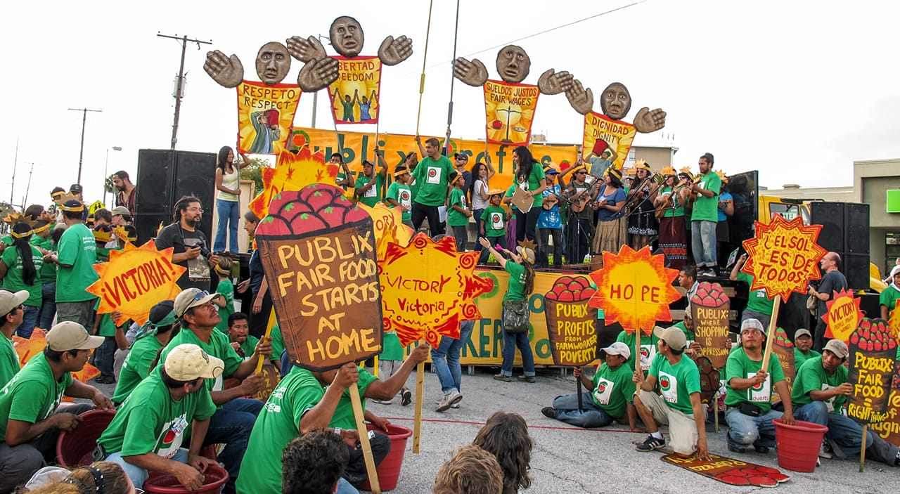 Photo from March for Rights, Respect, and Fair Food, Mona Caron and David Solnit in collaboration with the Coalition of Immokalee Workers, Florida, 2011 (Photo by Mona Caron, reproduced with permission from publisher)
