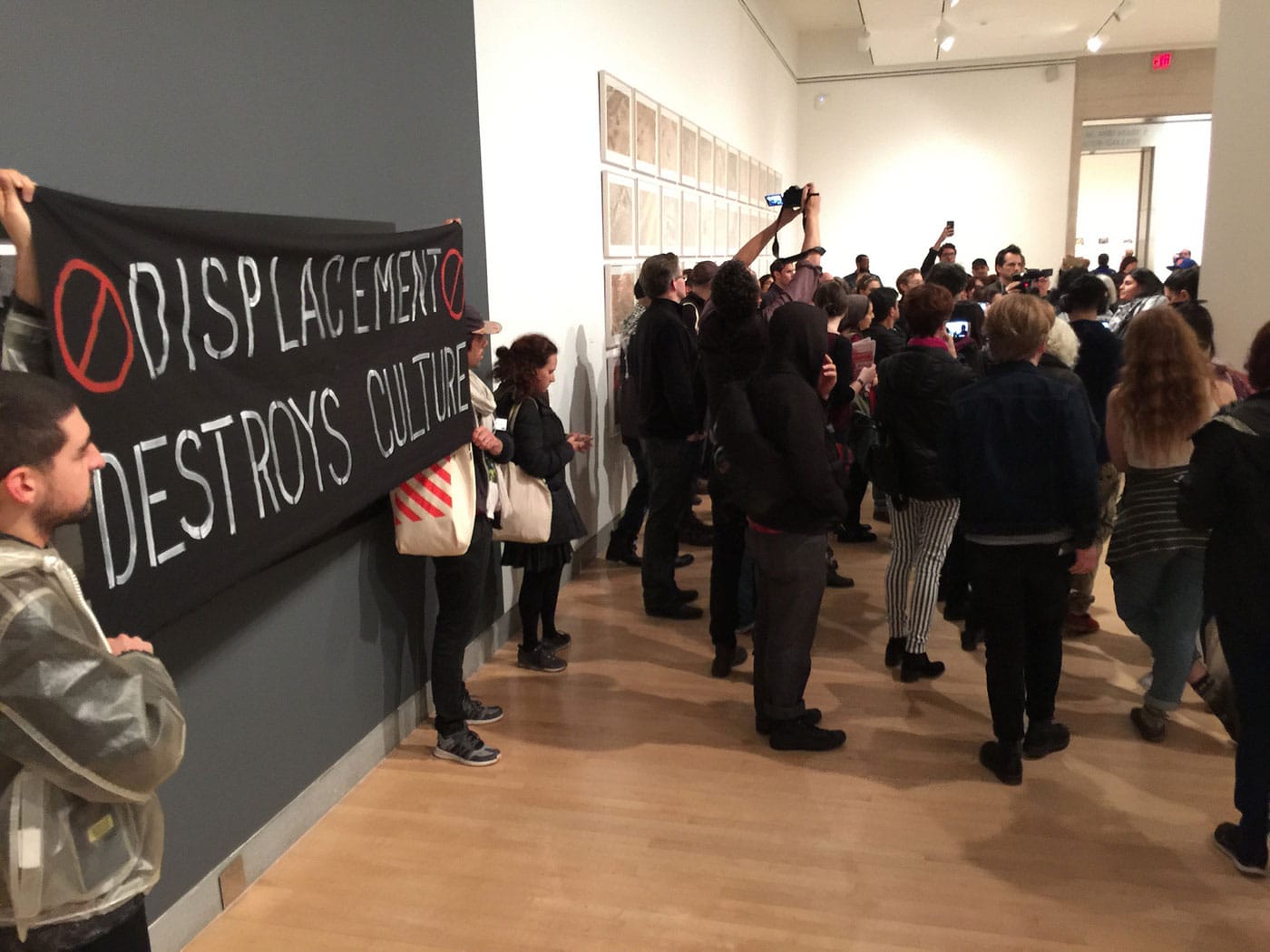 Another aspect of the gallery with a second banner unfurled. (photo Hrag Vartanian/Hyperallergic)