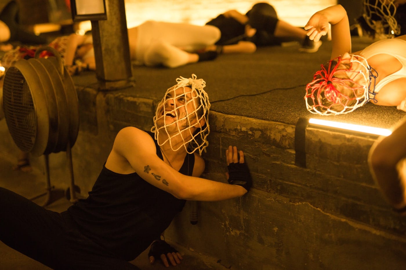 In the warehouse, acting out being "caged"