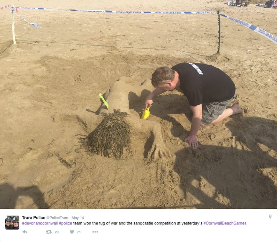 A member of the winning Devon and Cornwall Police team sculpting a nude murder victim at the Cornwall Beach Games (screenshot via Twitter)