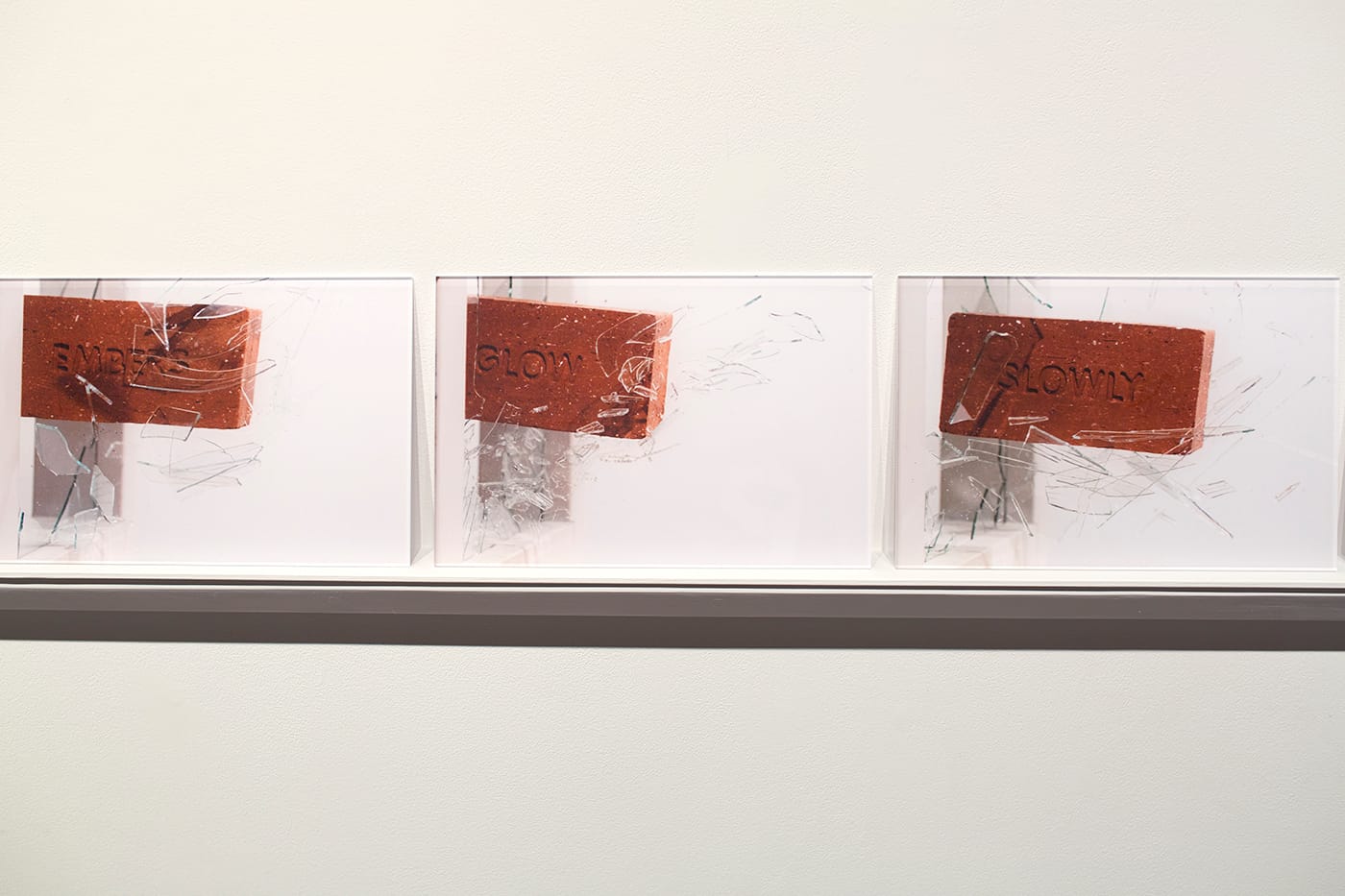 Detail view of Anthony Marcellini, "When Bricks Become Verses" (2016), 26 photographs on shelf, produced with Forterra Brick, Corunna, Michigan, and photographed by P.D. Rearick (all images courtesy Anthony Marcellini and Simone DeSousa Gallery)