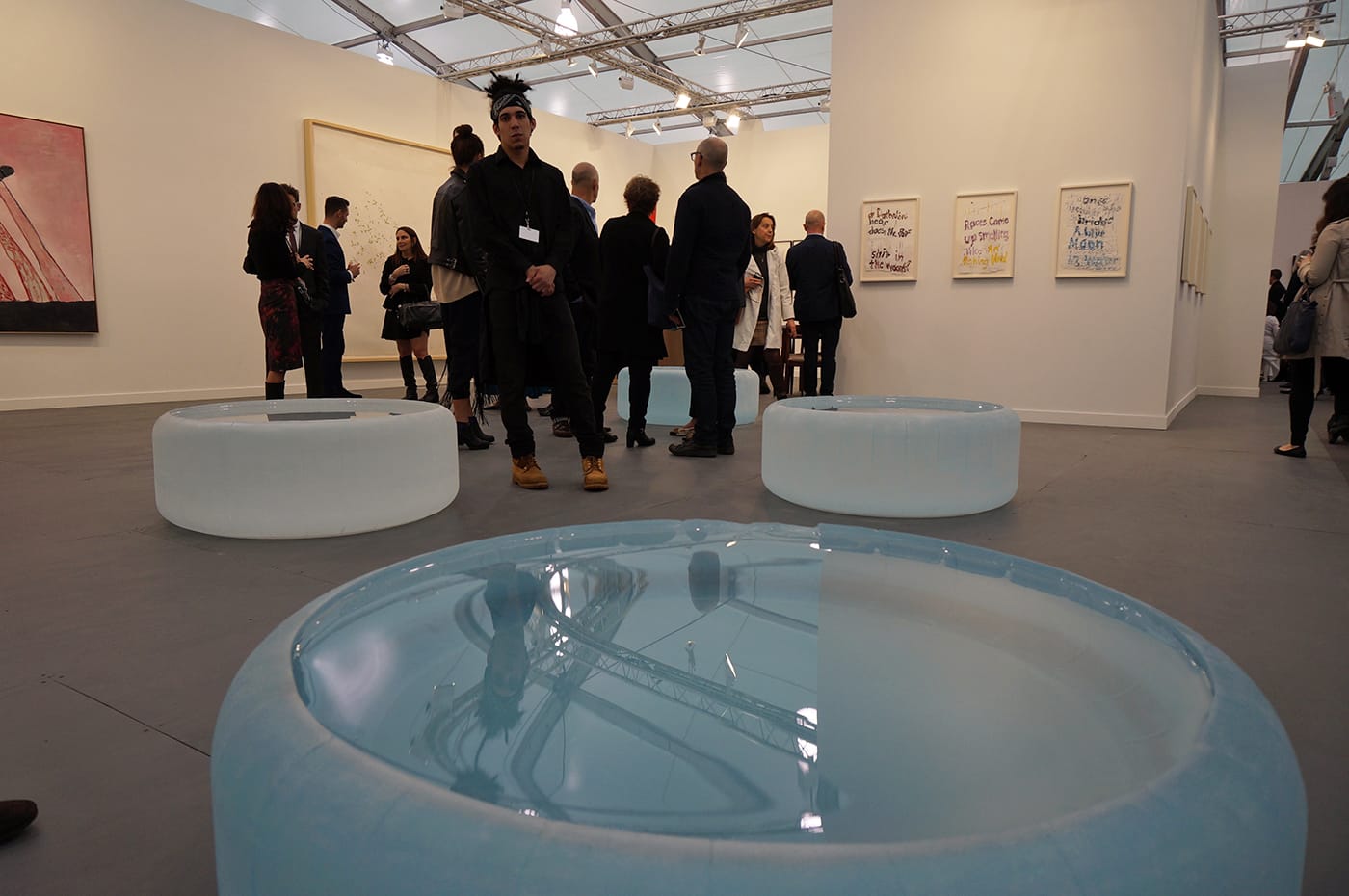 Sculptures by Roni Horn being guarded at Hauser & Wirth's booth