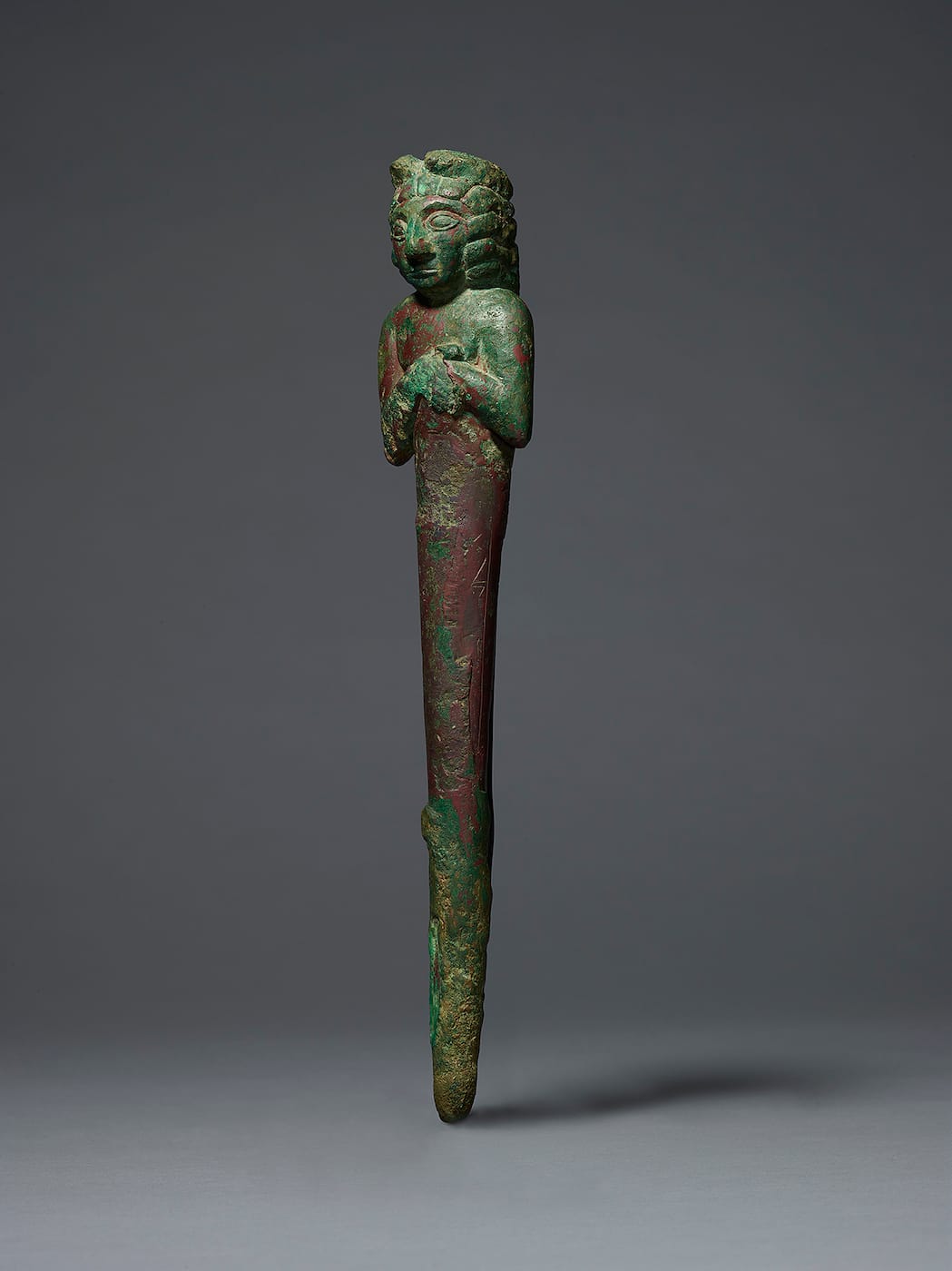 Foundation figure in the form of a nail surmounted by the bust of a god (Sumerian, Early Dynastic III period, 2600–2300 BCE), copper alloy (courtesy private collection, via Morgan Library & Museum)