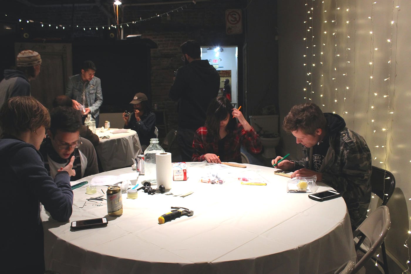 The workshop at Spread Art, with participants working alone or in couples to create their linguaphones