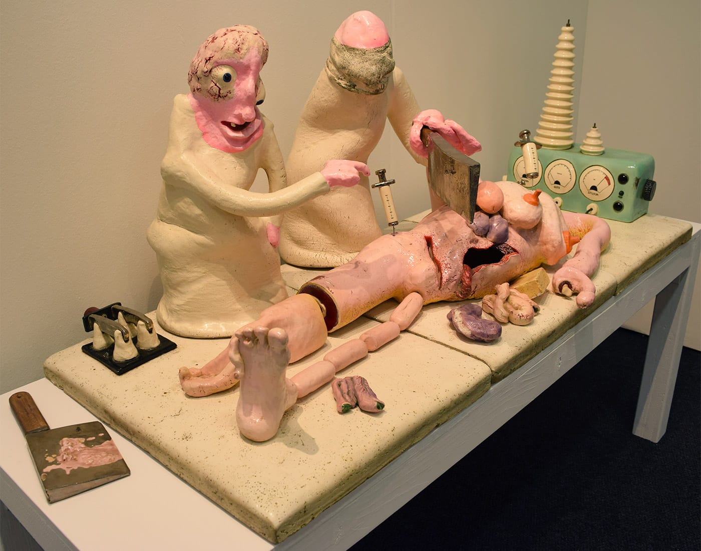 In the Landing gallery booth, Peter Saul and Clayton Bailey's "The Mad Doctor's Operation" (1974), glazed ceramic, 72 x 22 x 25 in