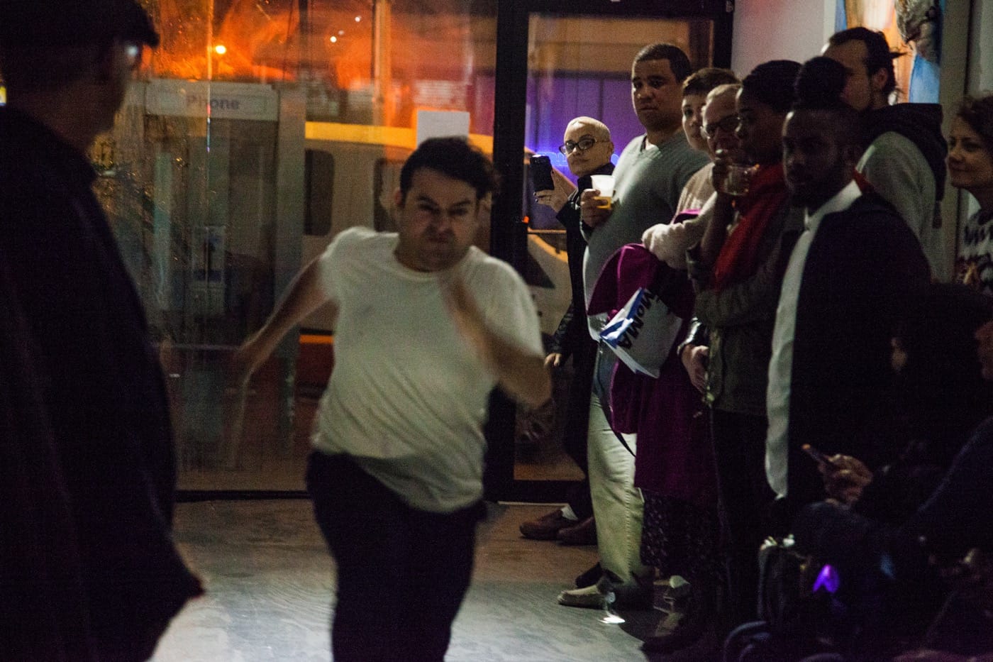 Geraldo Mercado running through the gallery at Performance Anxiety. Photo by Gregory Paul
