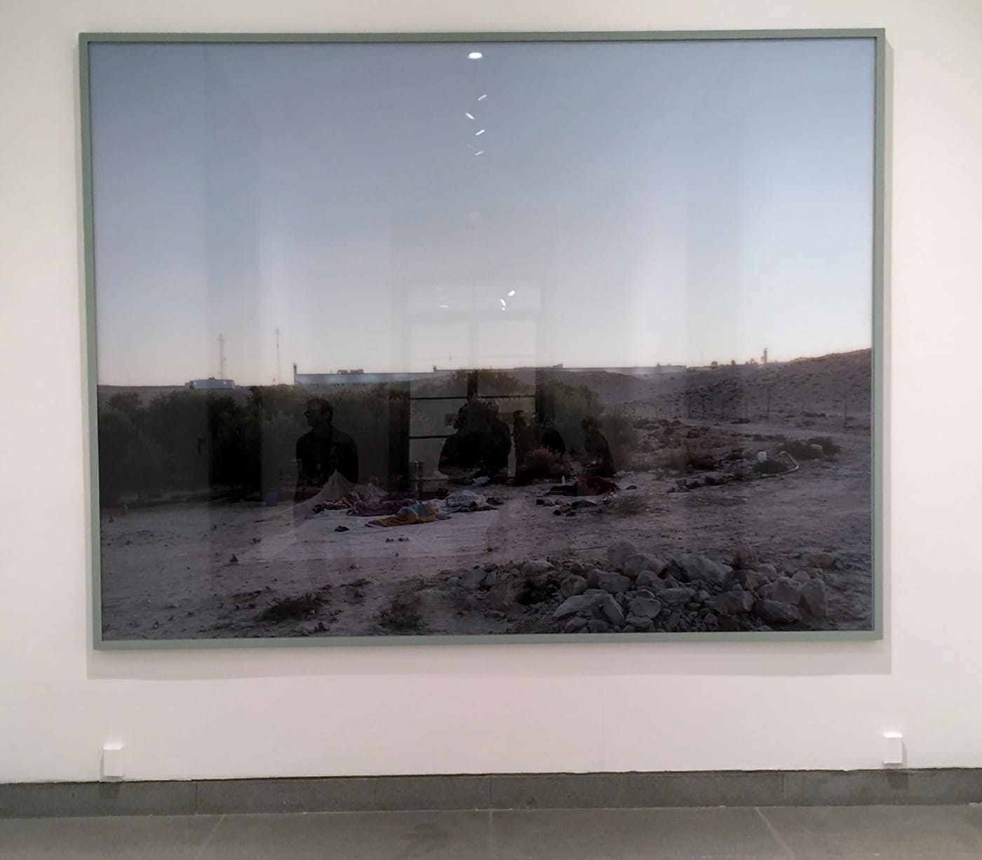 Jeff Wall's large photograph greets visits to the This Place exhibition at the Brooklyn Museum.