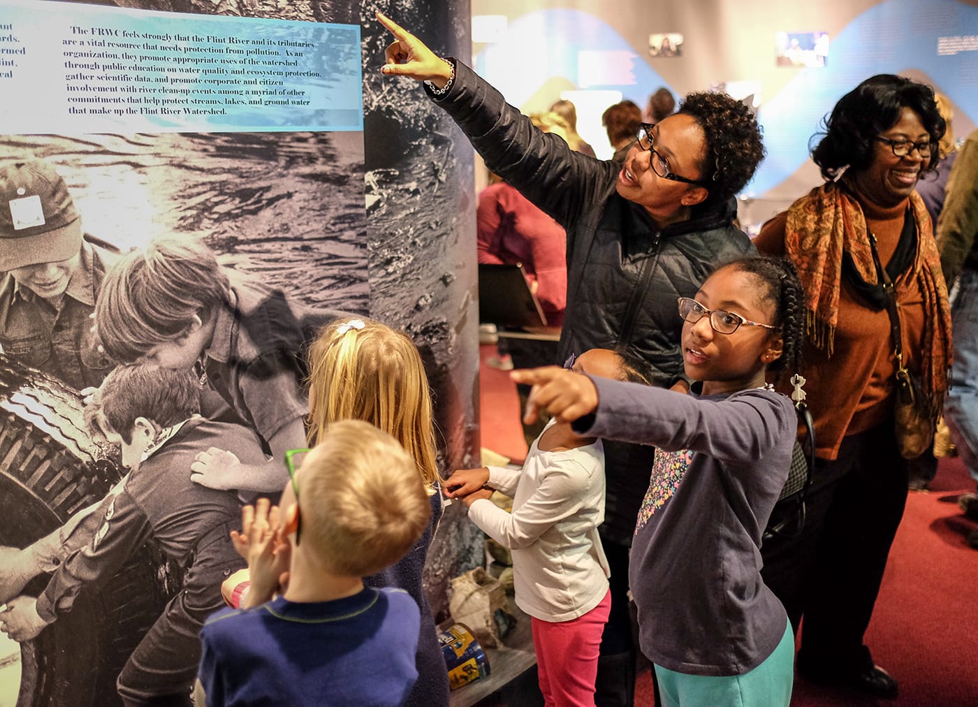 Visitors at 'Water's Extreme Journey,' recently closed at the Sloan Museum