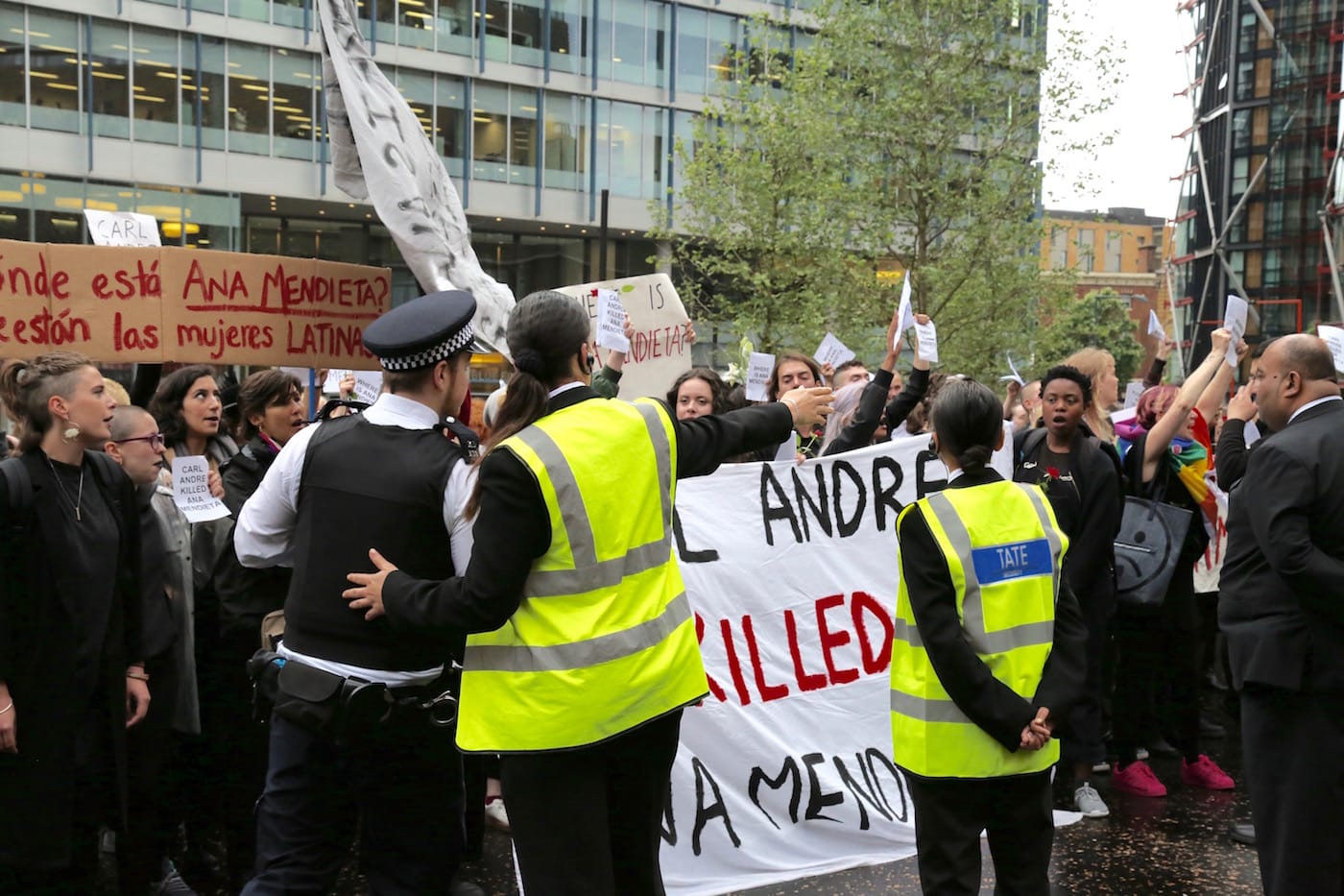 Legal observers discuss the protest with the police