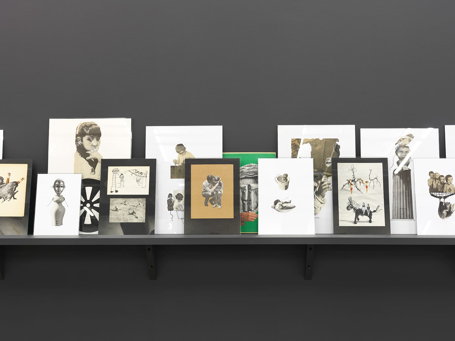 "Untitled (a mouse's home is the snake's body)" (2016), collages on paper, glass, wood, and paint, 24.5 x 150 x 9 inches