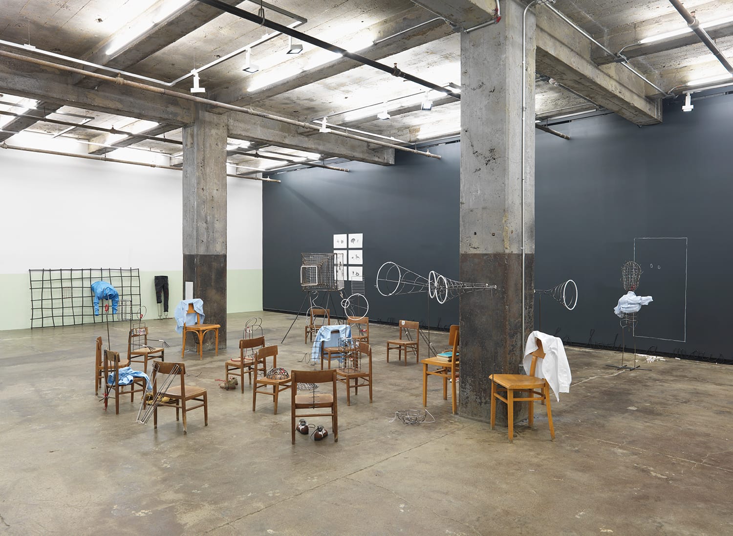 "Group Therapy of Office of Delusional Ideas" (2016), wooden chairs, metal, string, books, textiles, shoes, paper, and glass, dimensions variable
