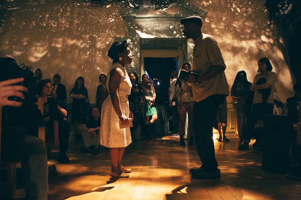 A performance taking place in Abigail DeVille's 'Only When It’s Dark Enough Can You See The Stars' at the former Peale Museum