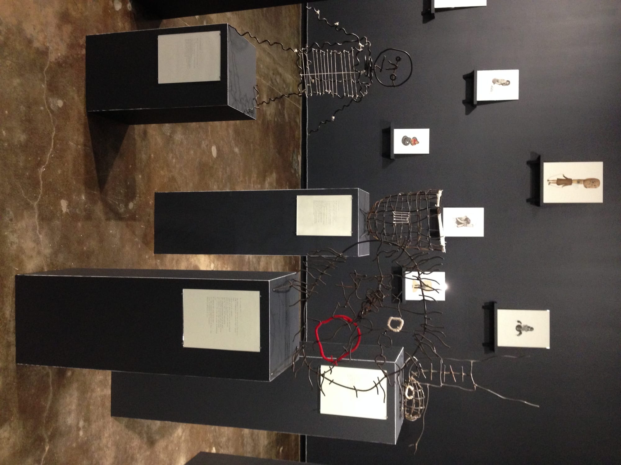 "Body in the Fence I" (2016), metal, textile, paper, and glass, 49 x 87 x 19 inches (photo by the author for Hyperallergic) (click to enlarge)