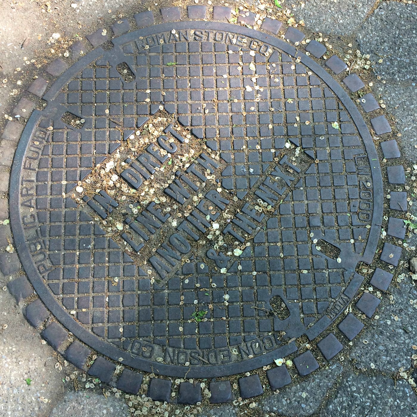 Manhole cover designed by Lawrence Weiner in Union Square