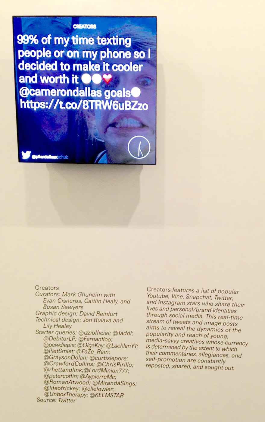 A monitor in the 'Public, Private, Secret' streaming photos from Instagram (photo by the author for Hyperallergic)