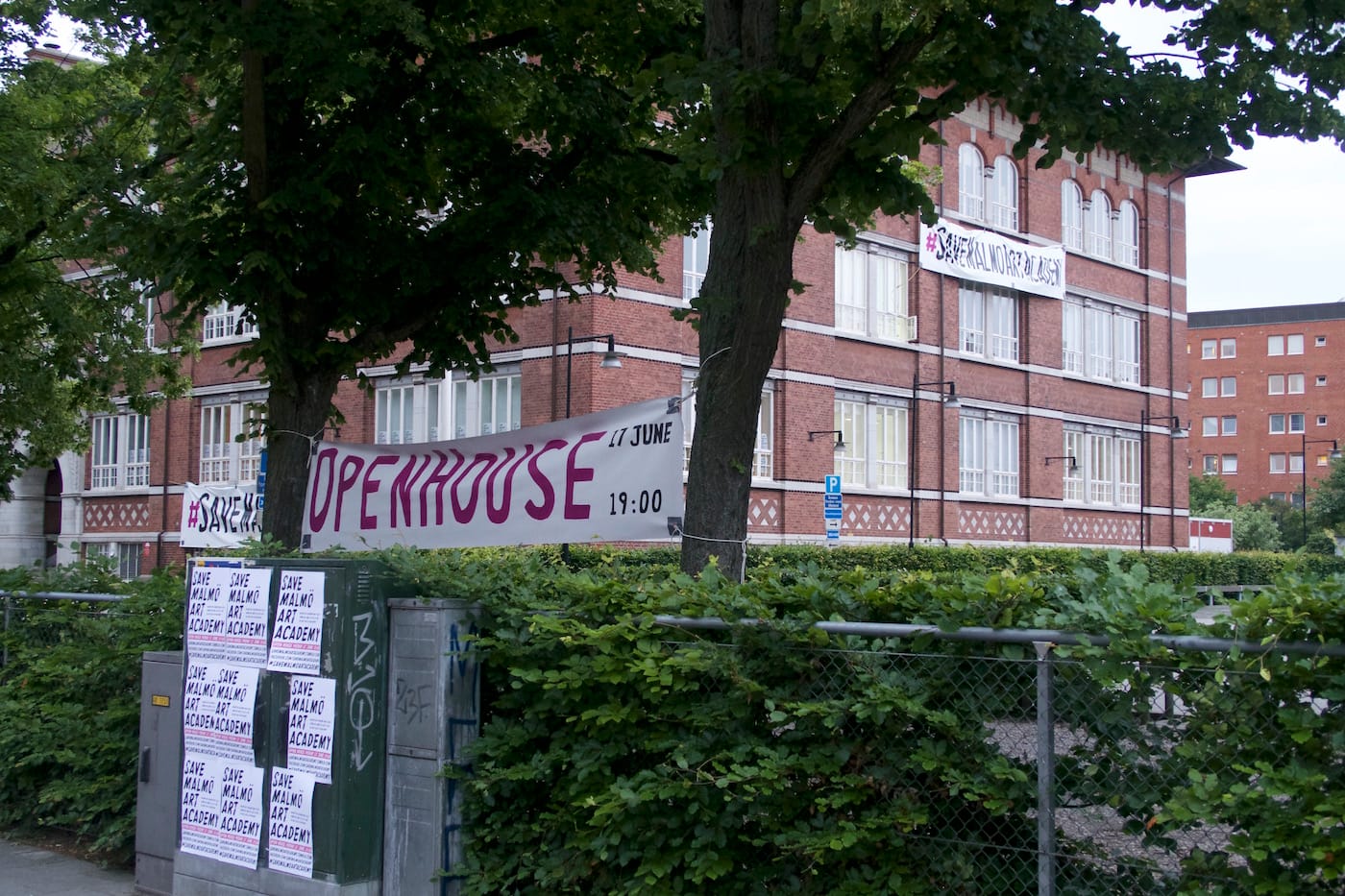 The exterior of the Malmö Art Academy with a banner and posters (all photos by and courtesy Andreas B. Amble)