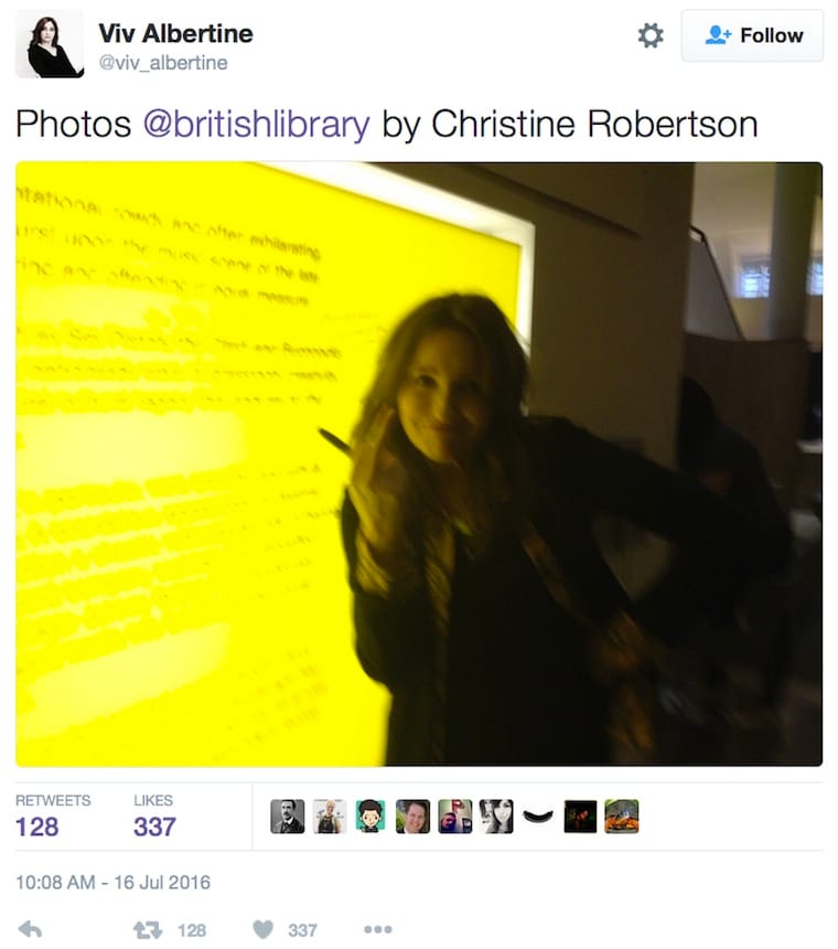 Viv Albertine alongside her wall text revision at the British Library (screenshot by the author via Twitter)
