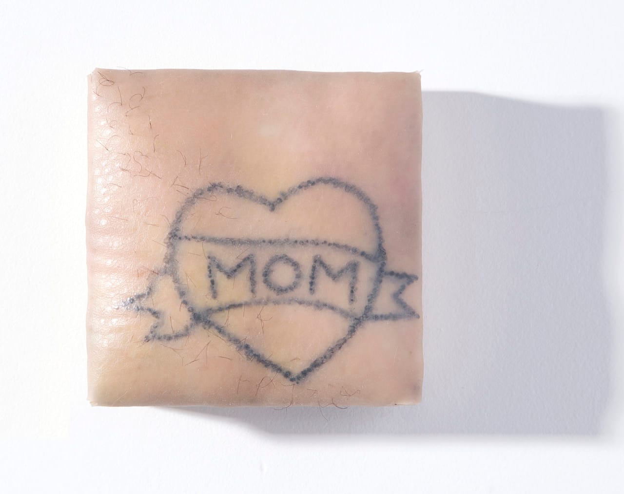 Olivia Taylor Untitled 2016 Silicone, synthetic hair, and padded panel