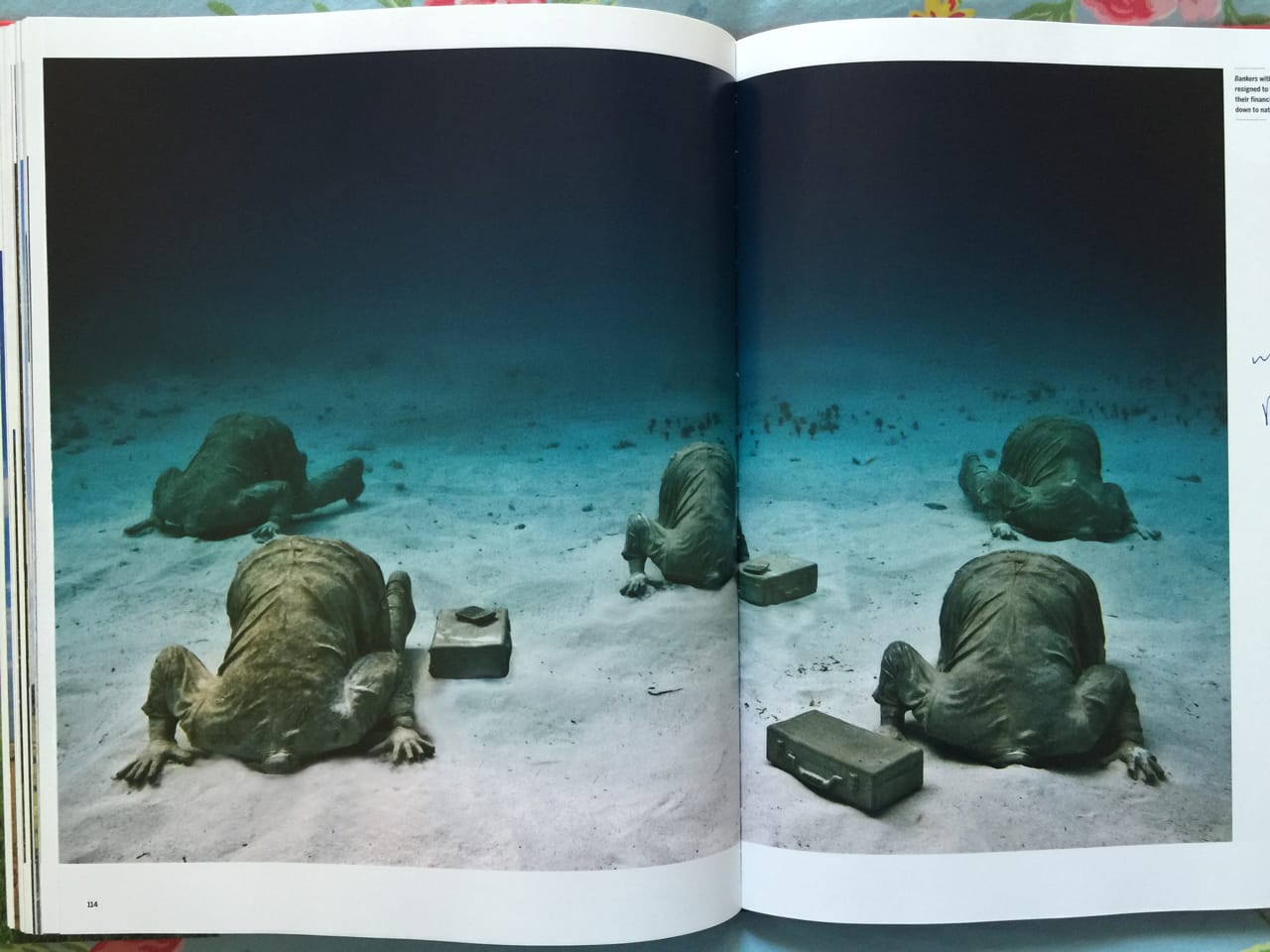 Spread in Outdoor Art featuring work titled "Bankers" by Jason deCaires Taylor. (Photo by author for Hyperallergic)