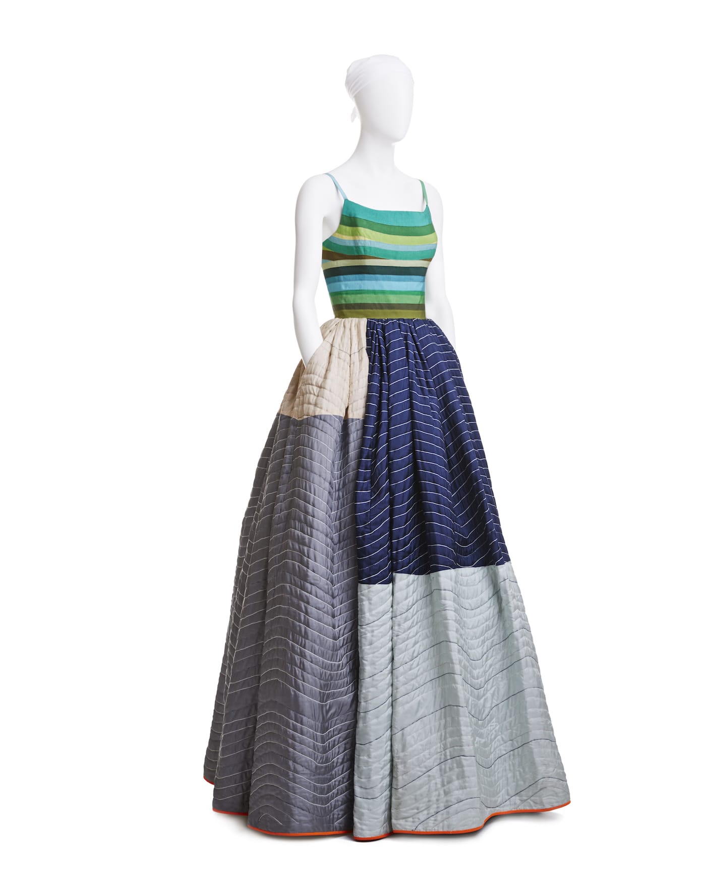 Elevator Pad Gown, grosgrain-ribbon bodice, quilted silk and lambís-wool skirt, spring 2005. Workhorse elevator padding used by movers inspired Mizrahi. He appropriated the quilting technique, but elevated the shipping blanket in a patchwork of blue, green, gray, and silver silk