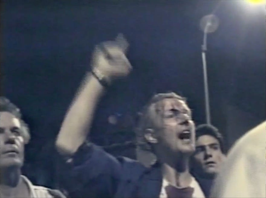 On August 6, 1988, New York City police attempted to enforce a curfew during a rally held at Tompkins Square Park. The police violently broke up the rally; videographer and artist Clayton Patterson filmed the event on his VHS camcorder. His footage captured multiple incidents of police brutality, leading to the indictment of six police officers. Patterson later appeared on Oprah, held up his camcorder, and declared, “This is a revolutionary tool. Little Brother is watching Big Brother.” New York City, 1988, courtesy of Clayton Patterson.