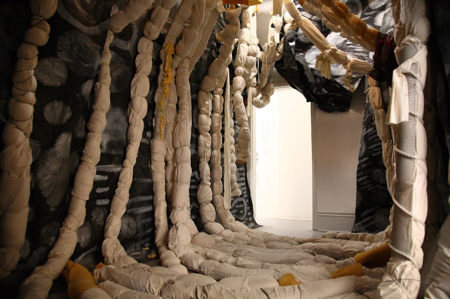 Agathe Snow, "Sludgie the Whale" (2007), installation with tarp, foam, cotton, spray paint, found objects, wire, dimensions variable