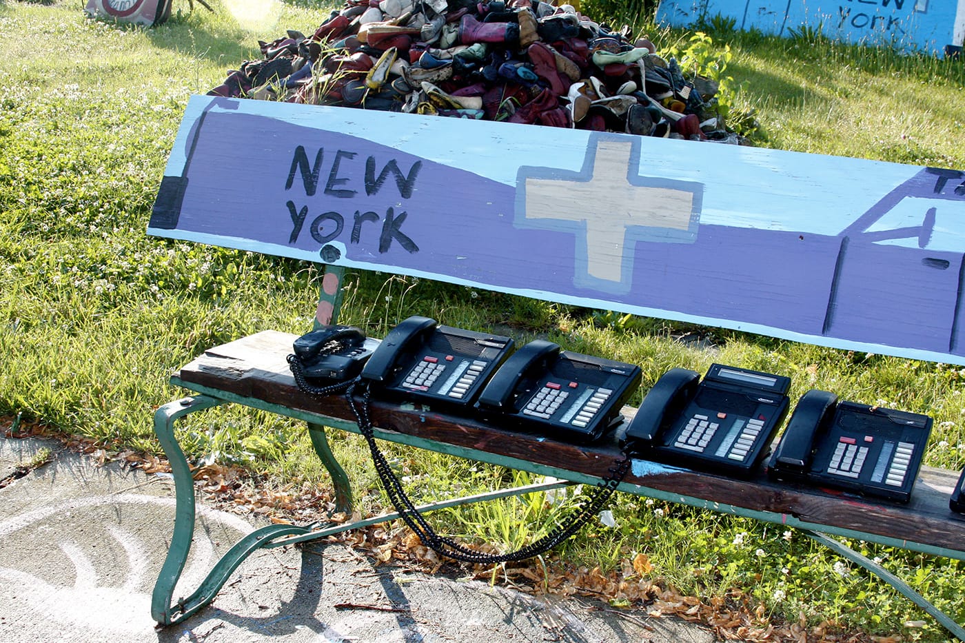 Recurring themes proliferate throughout the houses and sculptures, including phones, shoes, television sets, and other pieces reflective of discarded material culture.