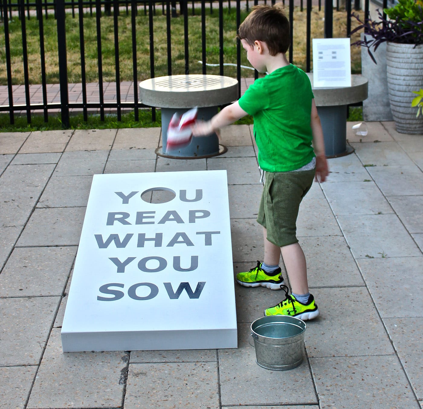 RaRoCo, "Trying to Achieve Balance between Work & Play" (2016), 2 cornhole boards, paint, beanbags, buckets