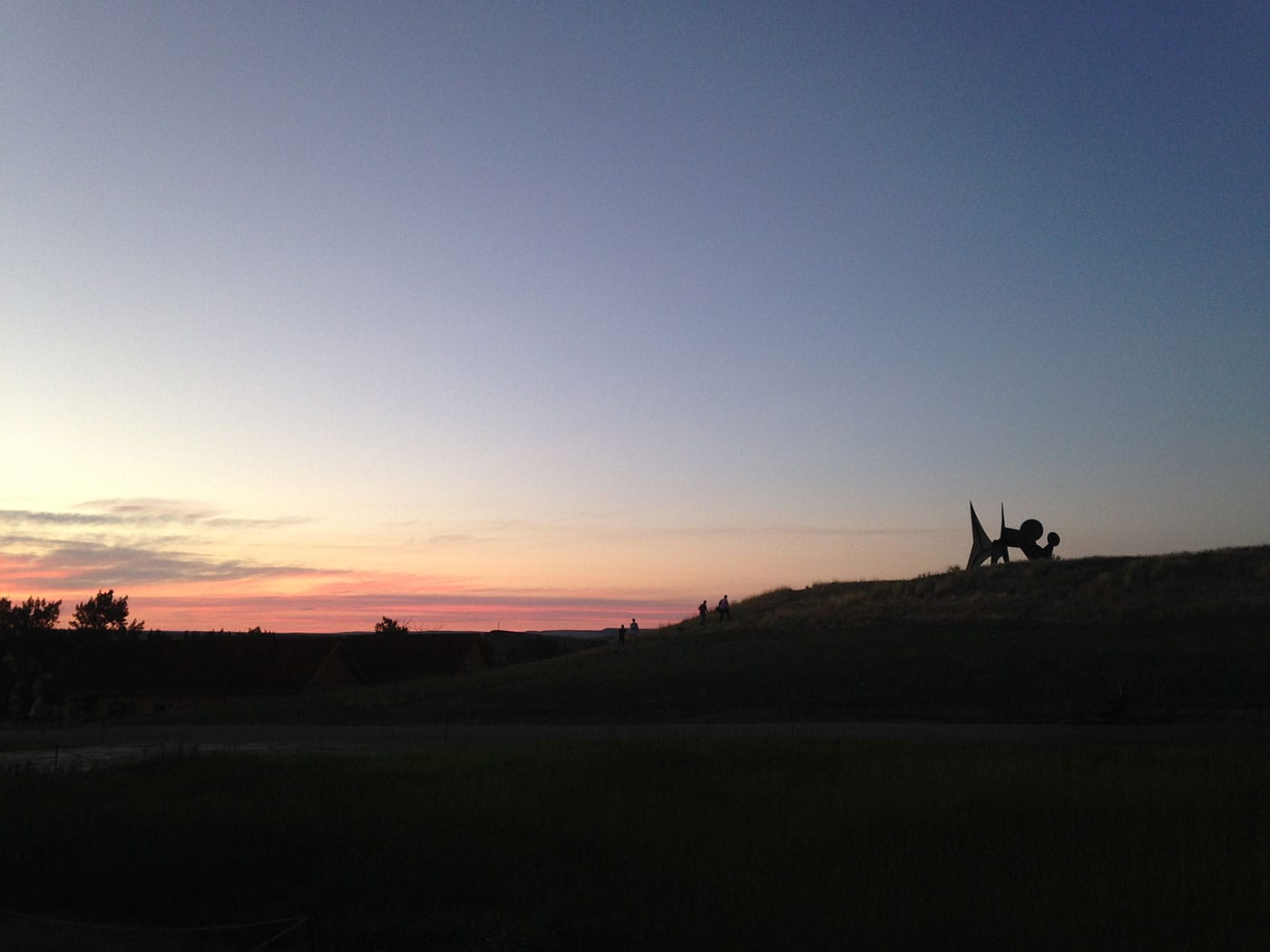 Alexander Calder's "Two Discs" (1965) holding court on its alluvial bench at sunset.
