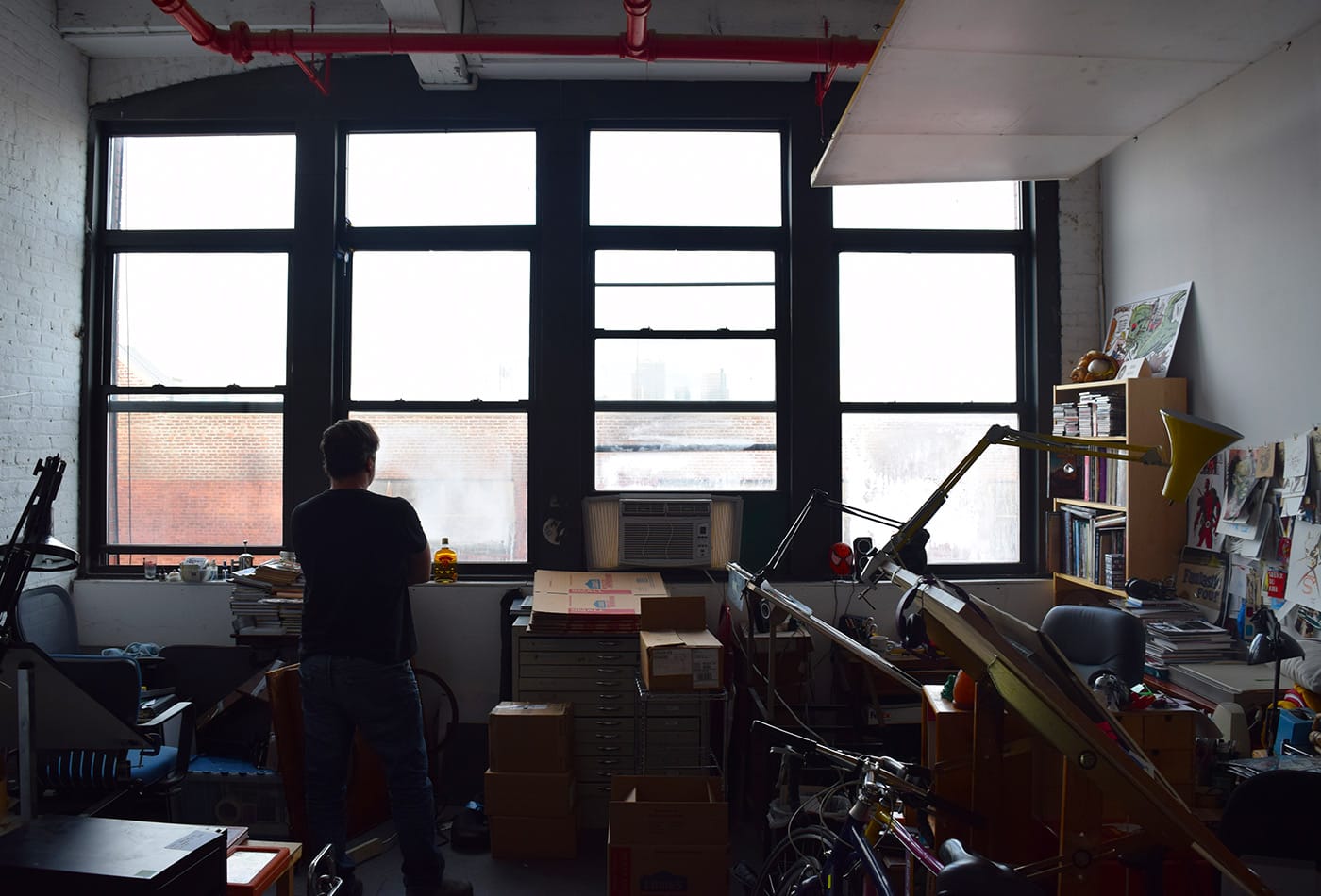 Dean Haspiel looks out the window of his studio at 112 2nd Avenue in Gowanus