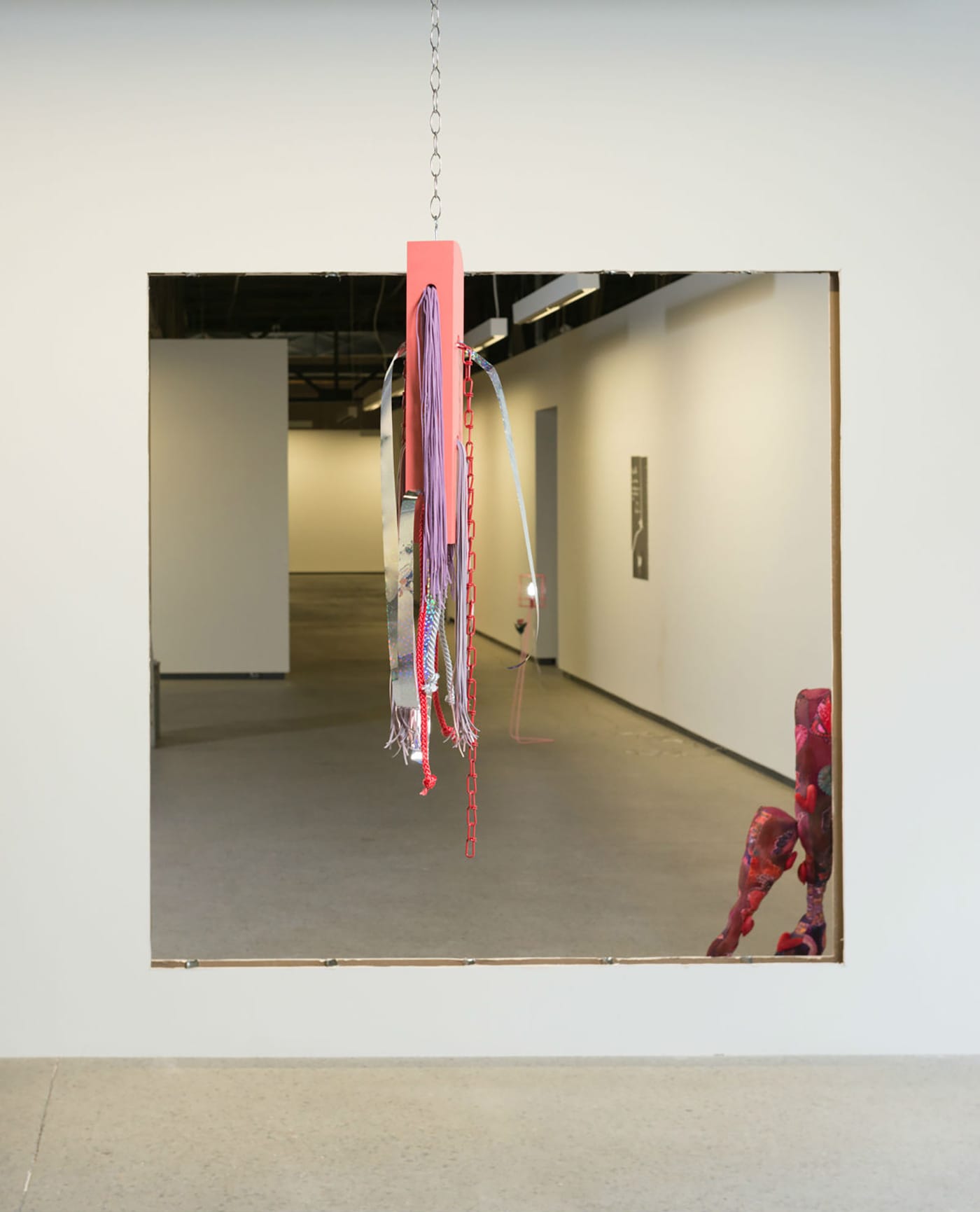 Maryse Larivière’s "Bird Baffle" (2016) hangin in front of a "window" with Athena Papadopoulos's "S & B, III" (2016) peeking through.