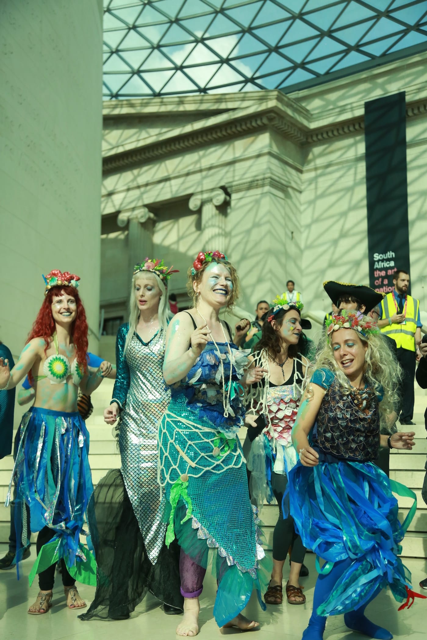 The merfolk chorus sing to thank BP for more 'Sunken Cities' during Sunday's performance protest at the British Museum.