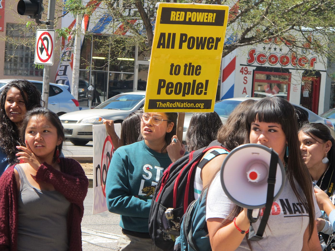 Jennifer Marley (holding megaphone) speaks at a #nodapl solidarity rally in Albuquerque last Thursday. (all photos by the author for Hyperallergic unless otherwise noted)