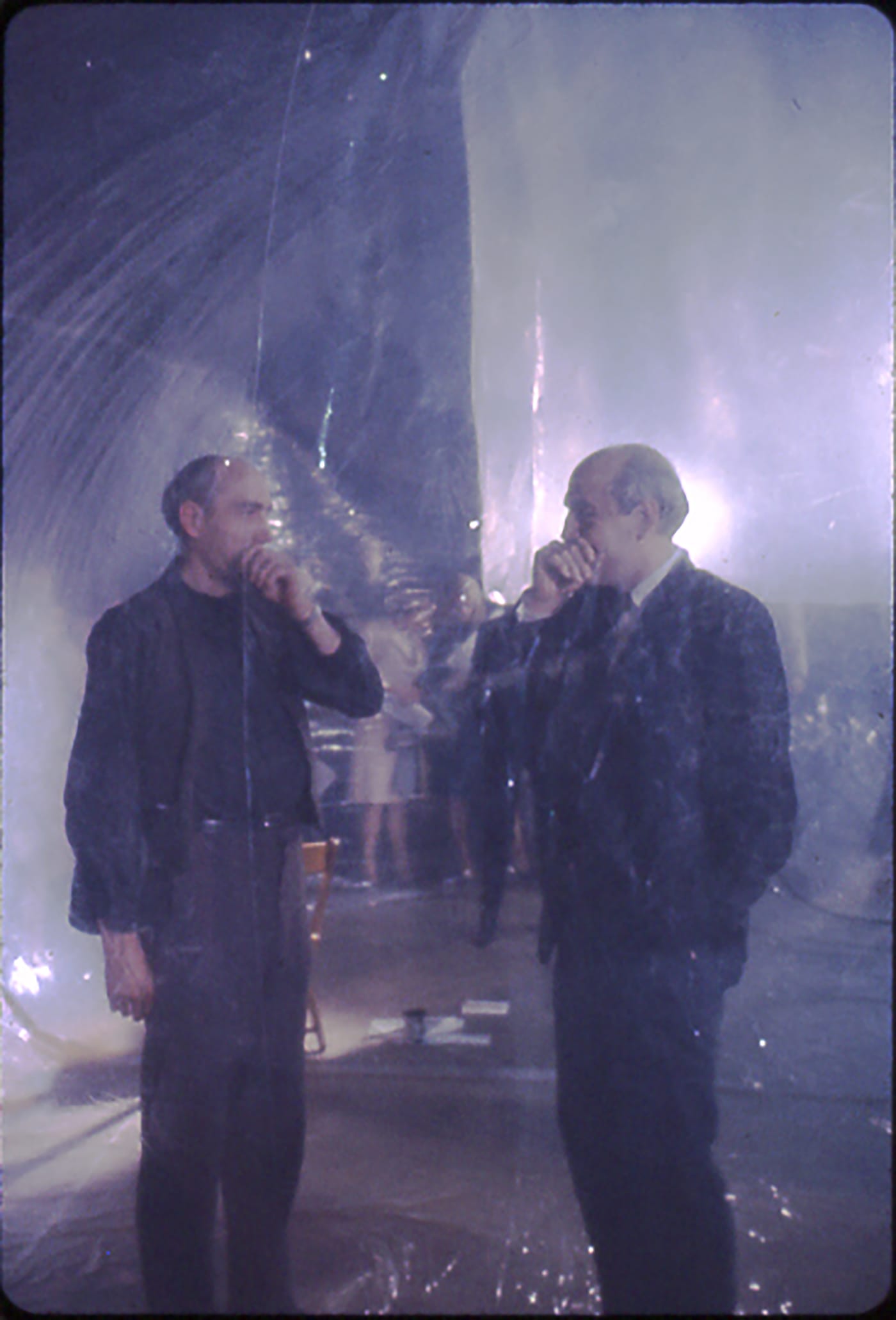 Michael Kirby and his twin brother standing as performers in Steve Paxton's inflated structure. Photo by Robert R. McElroy  