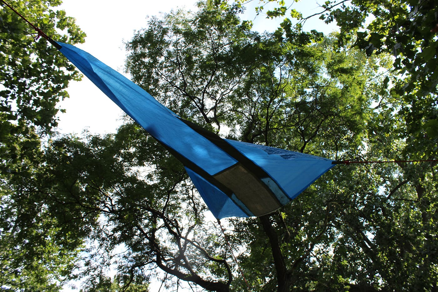 One in a series of patchwork tarp installations by Chad Wentzel, referencing paleo-futurism and 1980s outer space, as well as West African tradition and Art Deco/pseudo Native American style-biting.