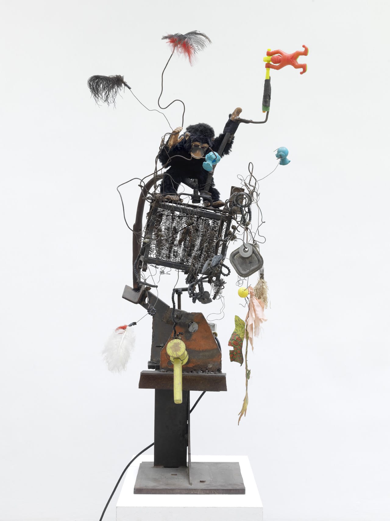 Jean Tinguely, "Wackel-Baluba" (1963), steel plate base, iron bars, springs and wires, plastic toys, feathers, toy monkey, electric motor, 49 5/8 x 15 3/4 x 25 1/4 in (courtesy NCAF et Galerie GP & N Vallois, Paris; photo by André Morin)