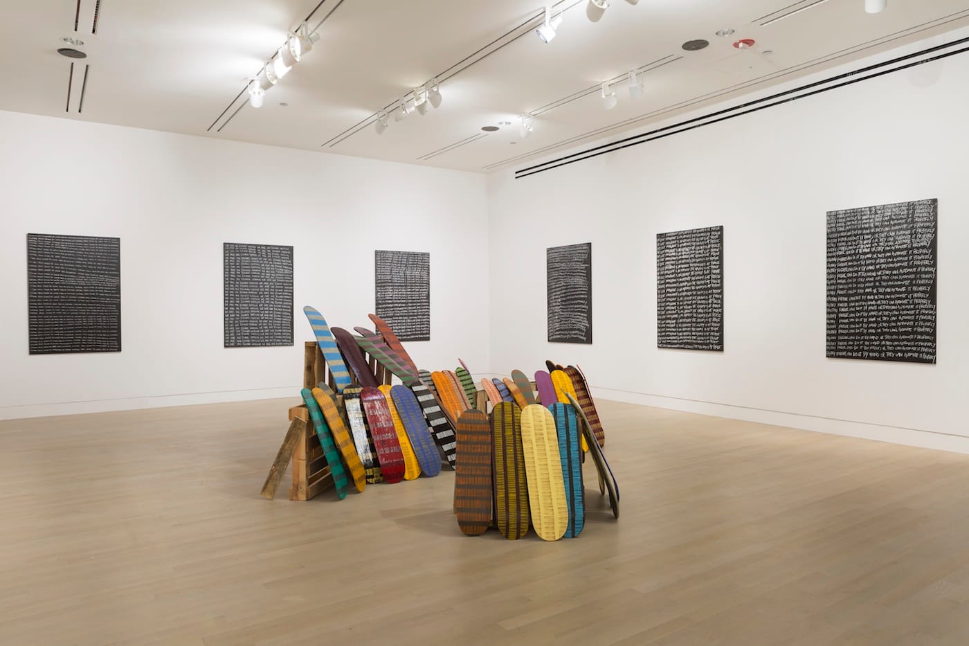 <em>Larry Achiampong: OPEN SEASON</em> installation view at the Logan Center Gallery, Reva and David Logan Center for the Arts, University of Chicago (photo courtesy Clare Britt)