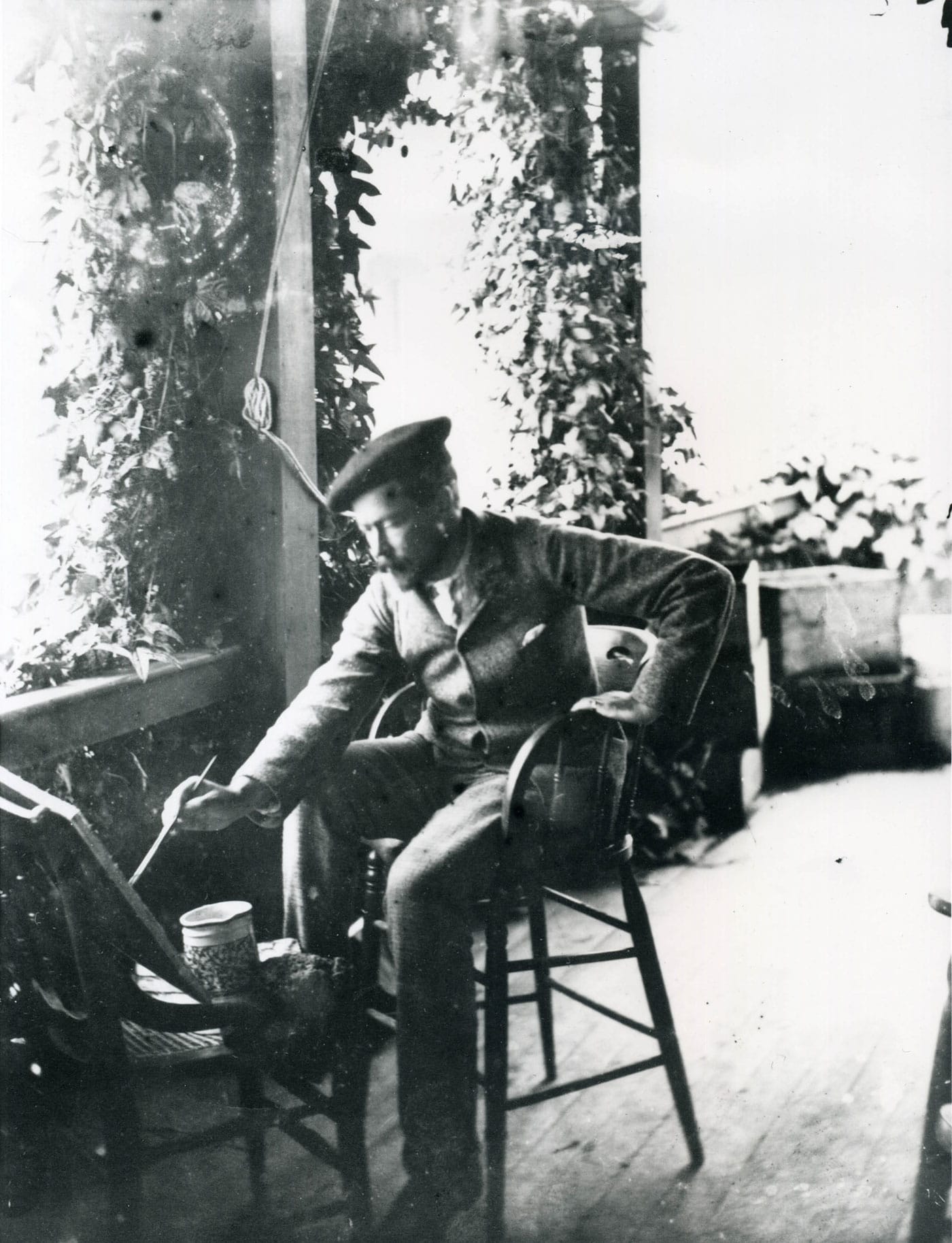 Attributed to Karl Thaxter, Childe Hassam painting on the porch of Celia Thaxter’s cottage (c. 1886) (Portsmouth Athenaeum, Portsmouth, New Hampshire, Isles of Shoals Photograph Collection)