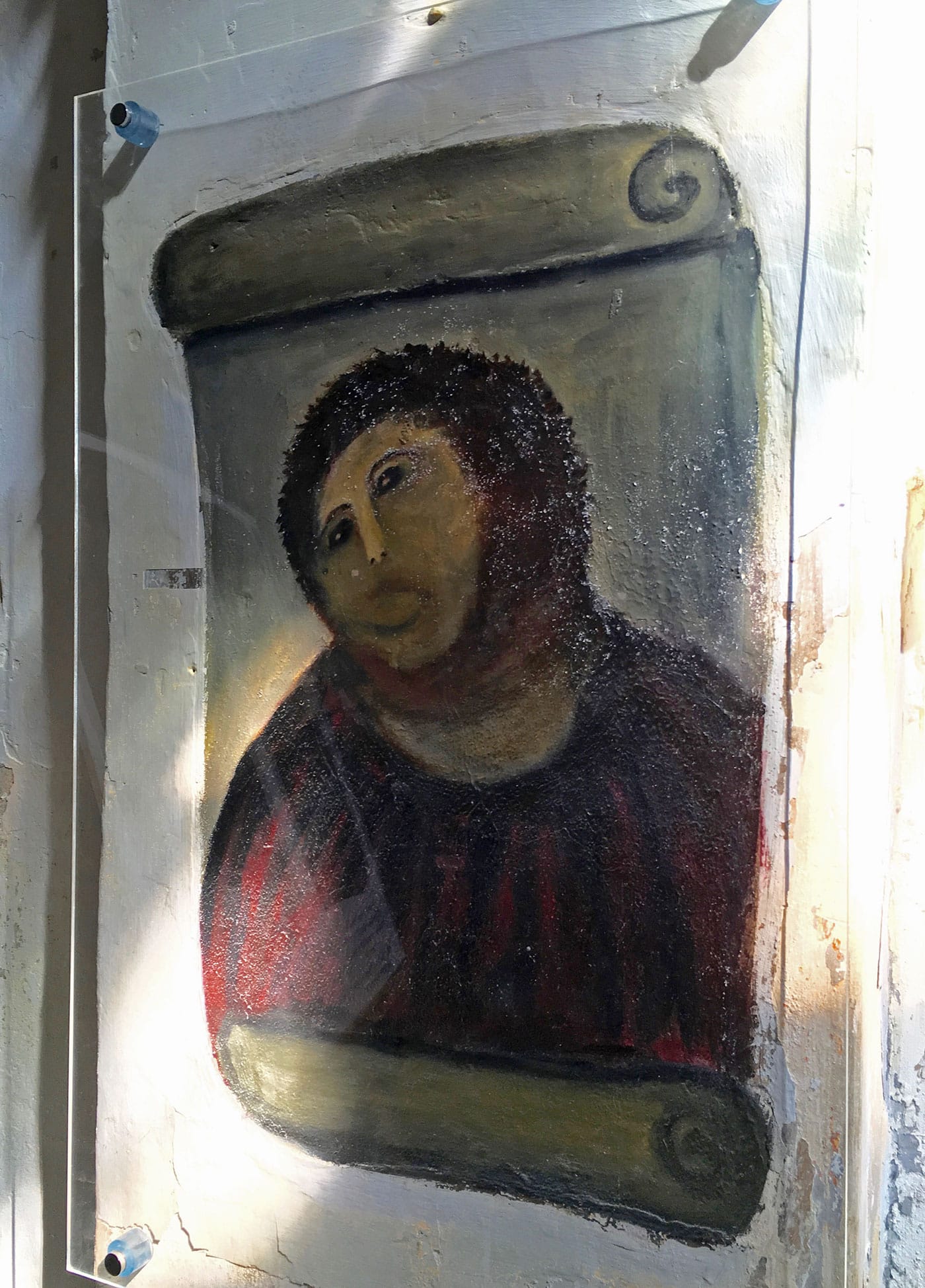 Cecilia Giménez Zueco’s “Beast Jesus” at Santuario de Misericordia, an amateur art restoration that went viral online and became a meme (all photos by the author for Hyperallergic)