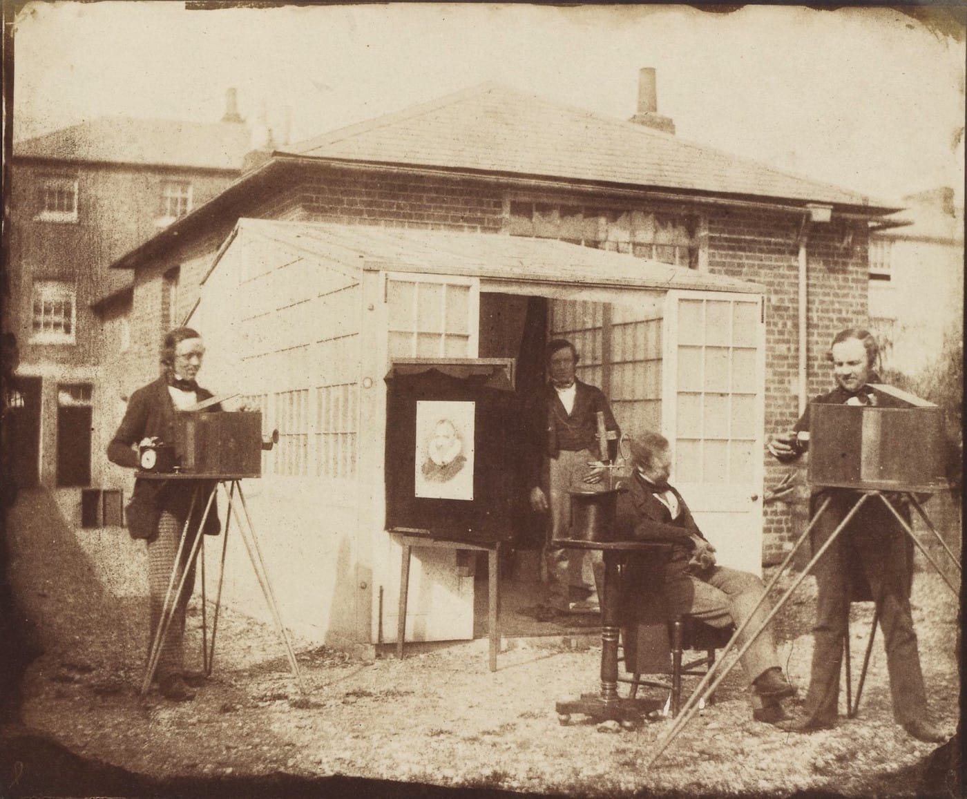 William Henry Fox Talbot and others at a commercial calotype establishment in Reading, England (1846) (via Wikimedia)