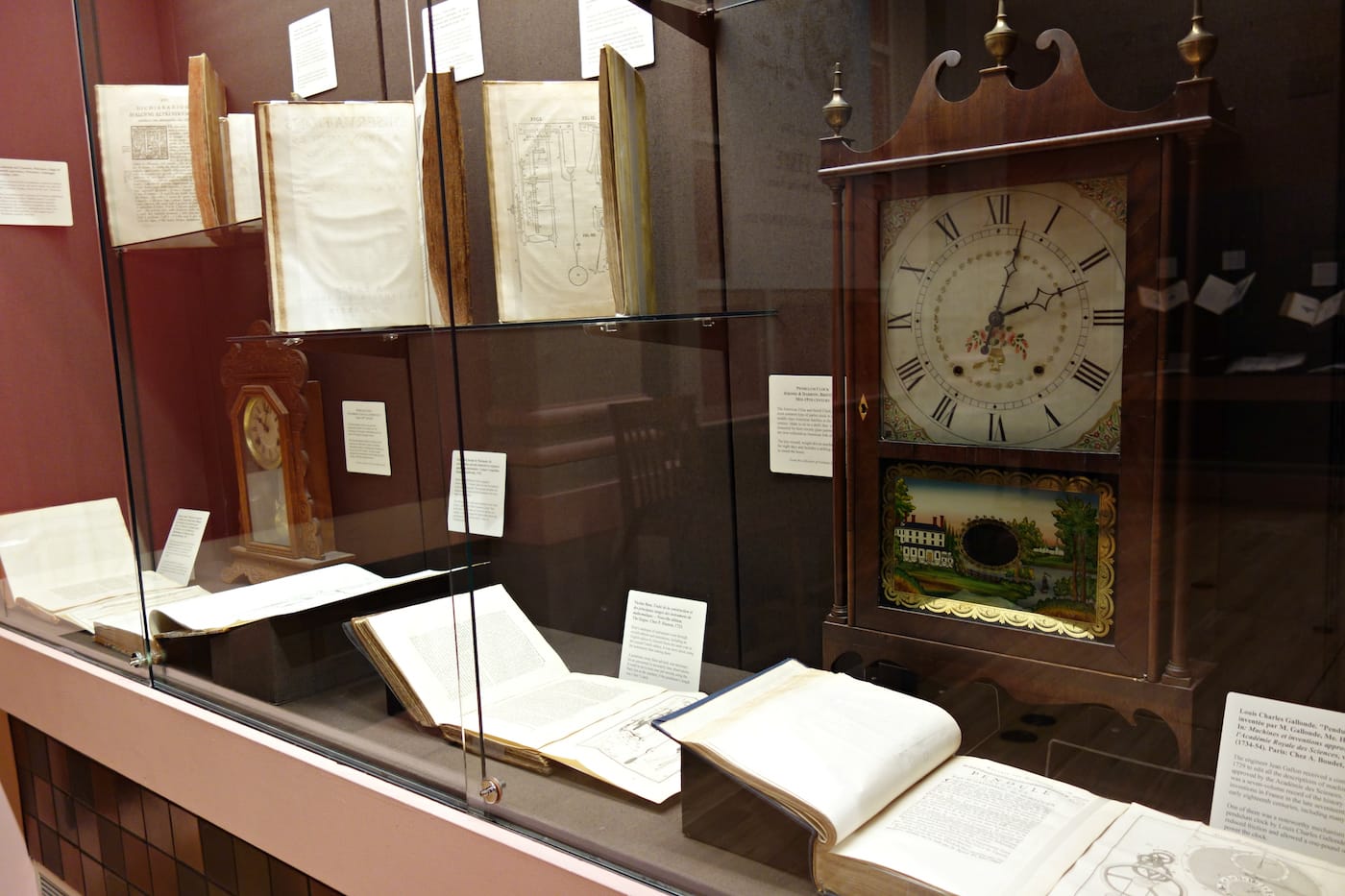 Installation view of 'On Time: The Quest for Precision. Books on Time and Timekeeping from the Linda Hall Library' at the Grolier Club (photo by the author for Hyperallergic)