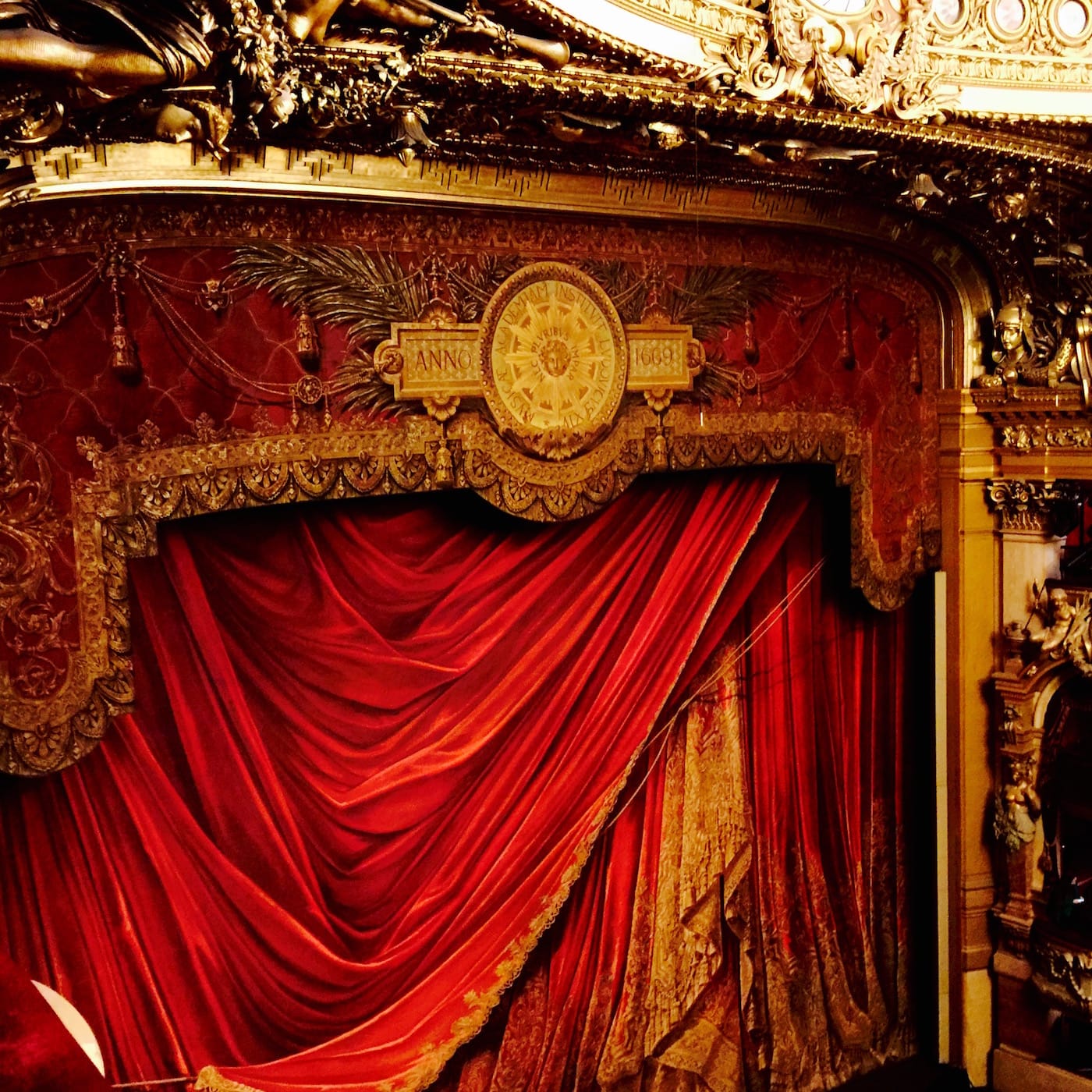 The curtain begins to rise.