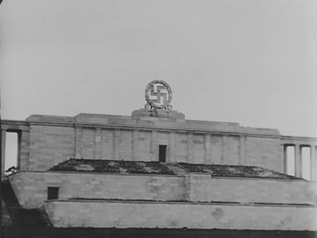 Nazi swastika destroyed from 'The War Ends in Europe' (1945) newsreel (via National Archives/GIPHY)