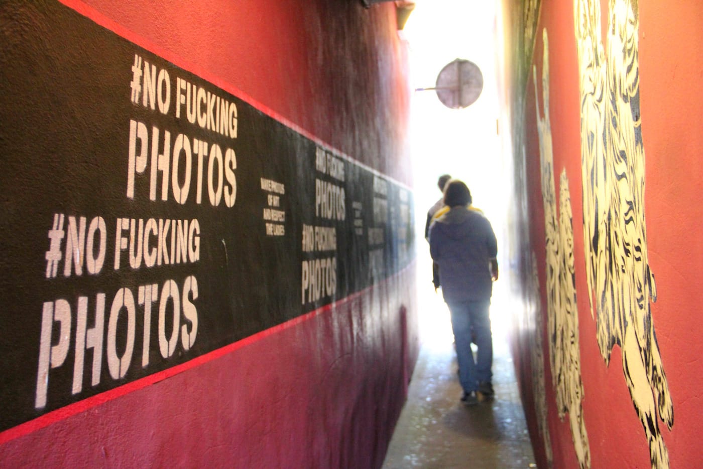 Partial view of Trompettersteeg with <em>No Fucking Photos</em> murals (all photos by the author for Hyperallergic)