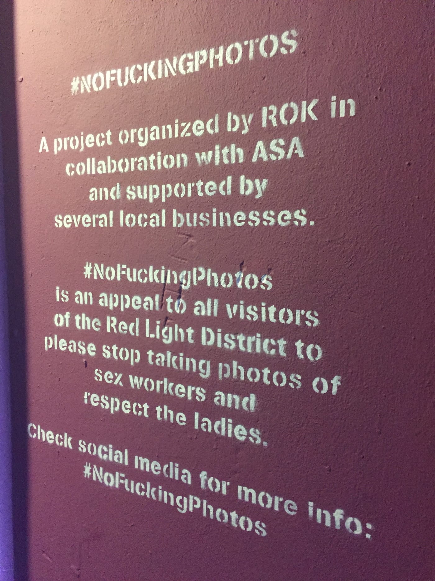 Partial view of Trompettersteeg with No Fucking Photos murals