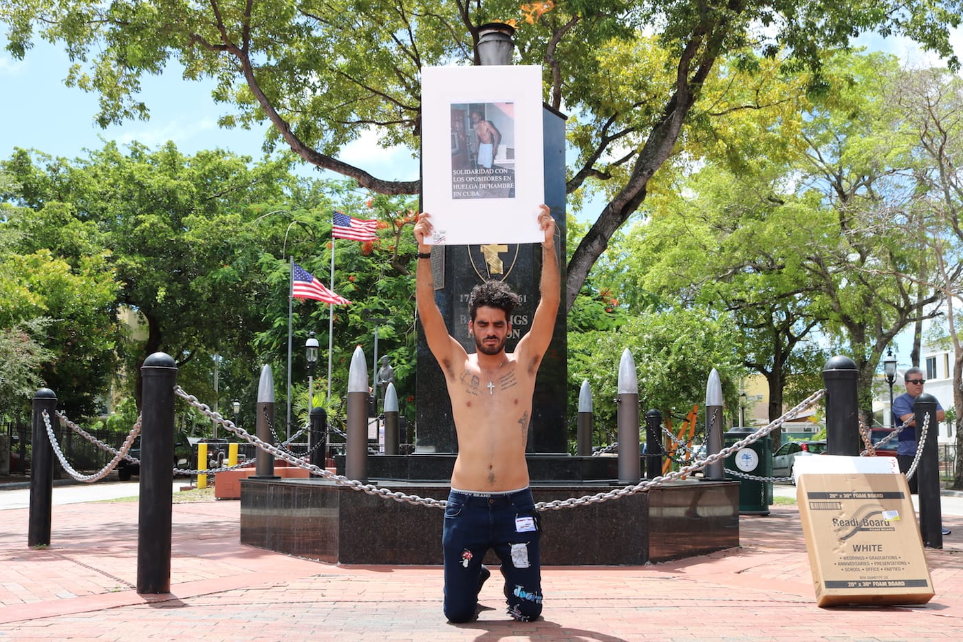 Danilo "El Sexto" holds a photograph taken during his imprisonment in Cuba in front of teh Bay of Pigs monument in Miami. (courtesy of Alexandra Martinez)