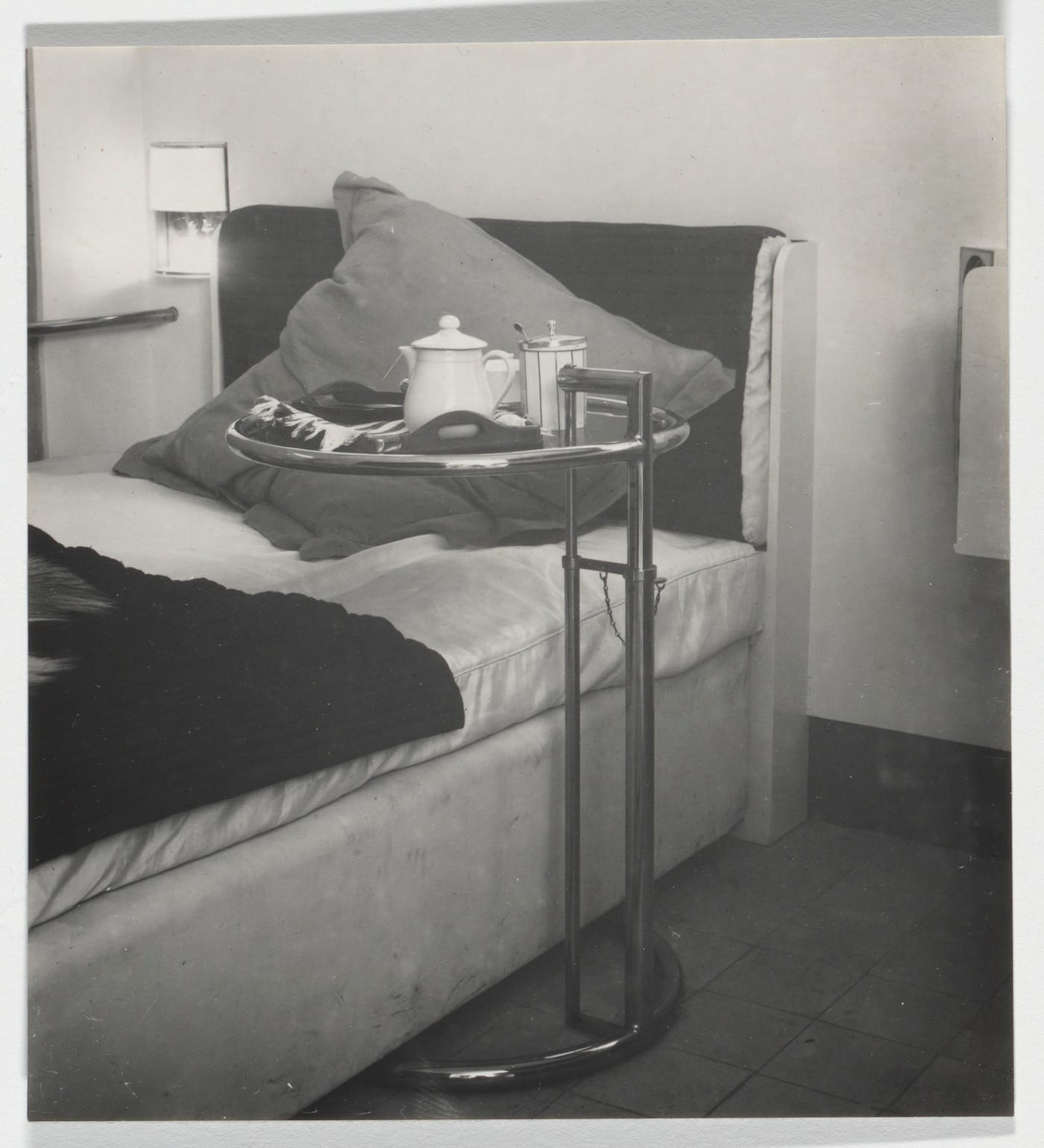 Eileen Gray, guest bedroom at E1027, showing Adjustable Bedside Table (Roquebrune-Cap-Martin, France, 1926–29), gelatin silver print (courtesy the Museum of Modern Art, Architecture & Design Study Center)