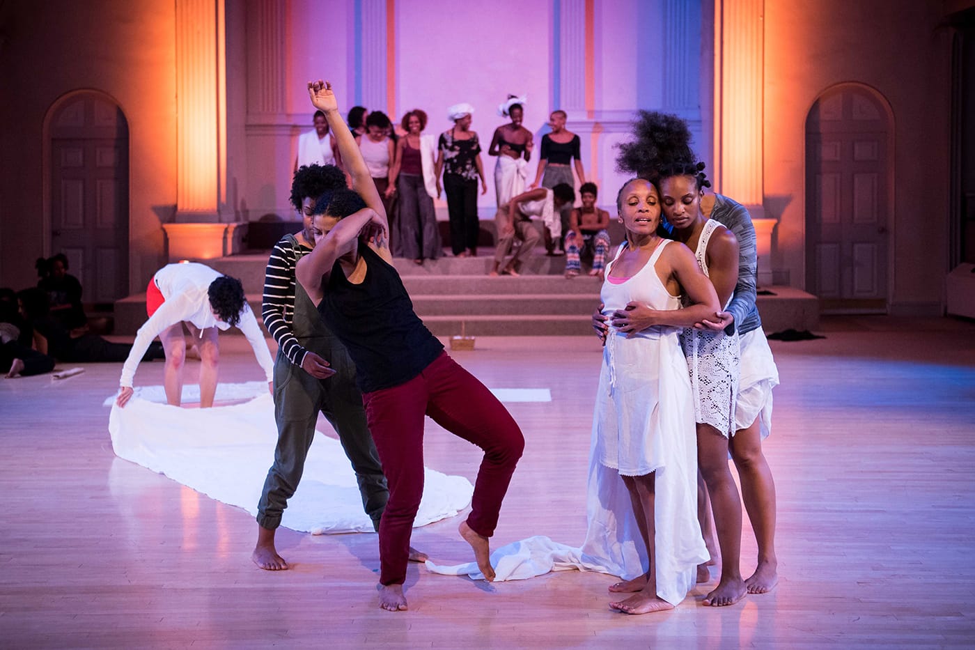 From left to right in the foreground: Rakiya Orange, Maria Bauman, Charmaine Warren, Davalois Fearon, and Edisa Weeks. Performing in the skeleton architecture, or the future of our worlds, Danspace Project. Photo: Ian Douglas/courtesy Danspace Project.