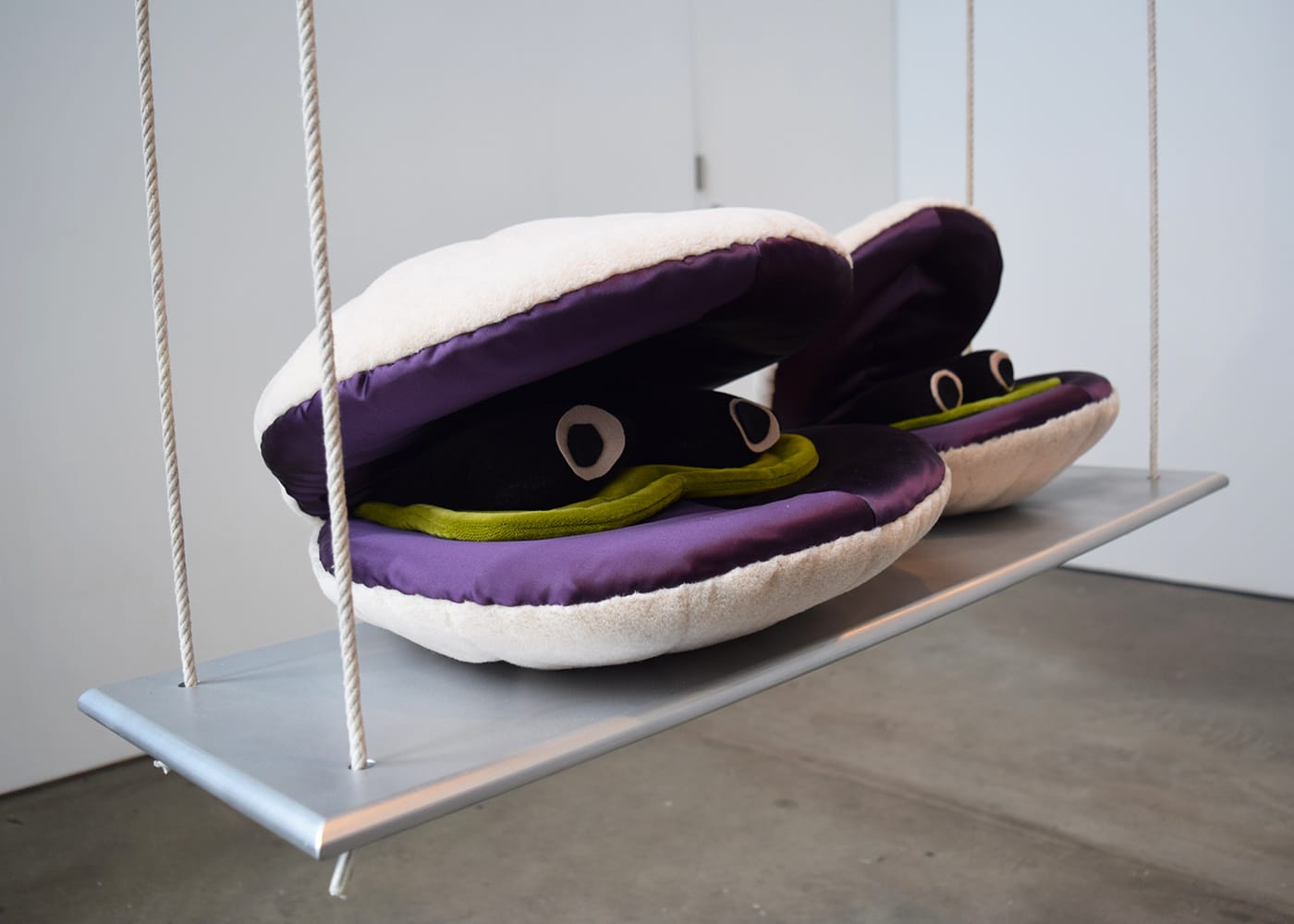Cosima von Bonin, "IDLER, LEZZER, TOSSPIECE (THE WOW SWING NOSE & SCALLOP VERSION)" (2010), steel, fiberglass, aluminum, styrofoam, rope, wood, velour, velvet, satin, felt, sand, paint