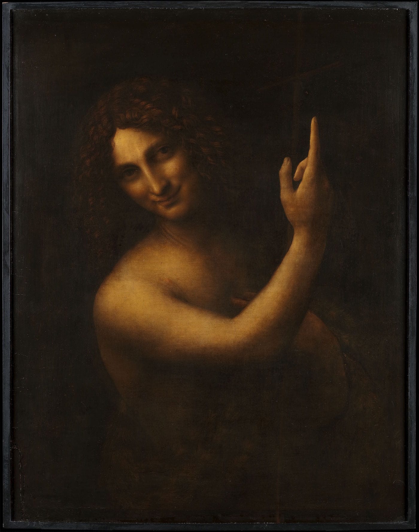 Leonardo da Vinci's "Saint John the Baptist" (c. 1513–16) before the recent restoration (© Musée du Louvre, dist. RMN — Grand Palais / photo by Angële Dequier)